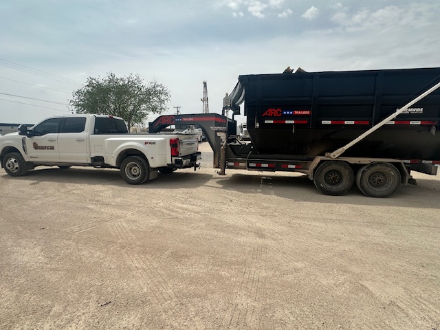SD Services truck and trailer staged on a jobsite lot.
