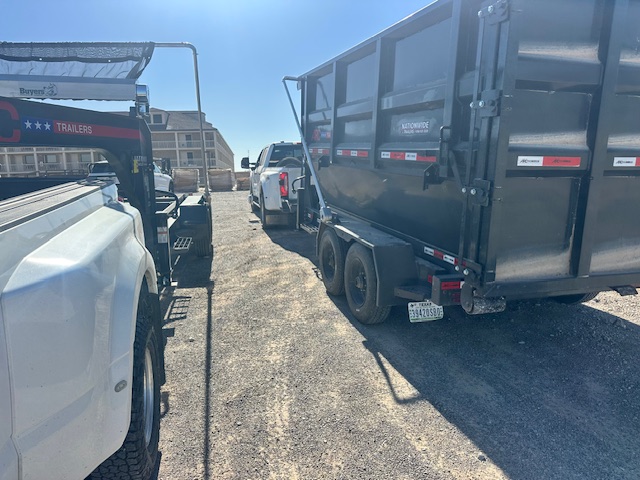 Two SD Services containers positioned near industrial plant equipment.